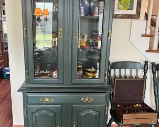 Green painted hutch and two green painted dining/bistro chairs.