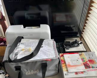 Husqvarna Viking H/Class sewing machine; Ashford spinning wheel.