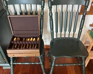 Two green dining/bistro chairs.