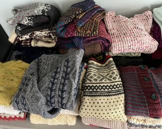 Many wool sweaters, some brand names (CDG, Elan, Eddie Bauer, Orvis, L.L. Bean, and others), and some hand-made.