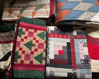 Large selection of vintage quilts. Many more shown in following photos.