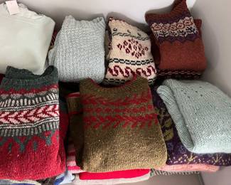 Many wool sweaters, some brand names (CDG, Elan, Eddie Bauer, Orvis, L.L. Bean, and others), and some hand-made.