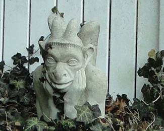 Monkey face gargoyle with horns cement