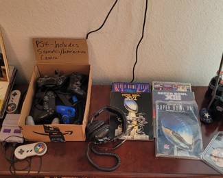 PS4 game console with 5 remotes, comic books, Disney vinyls
