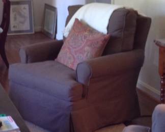 Pair of brown swivel rocking chairs