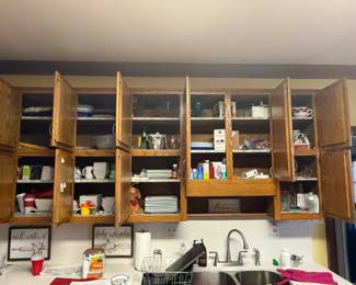 Kitchen. Lots of Cabinets Filled with Kitchen Items 