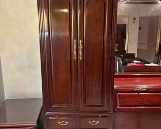 Wood armoire. All doors and drawers in great condition. Also has a pull out shelf. Bottom has 3 drawers. Top cabinet has 2 drawers and 2 shelves. 

Height 77.5”
Depth 18” 
Width 28”
