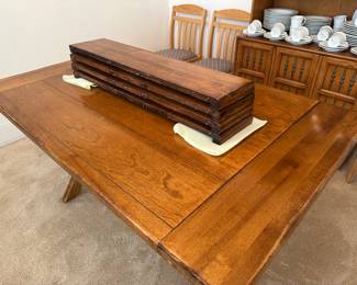 Table shown with four leaves stacked on top, use one or two or three or four, super adjustable size to fit your changing needs, each extension adds 7.5 inches