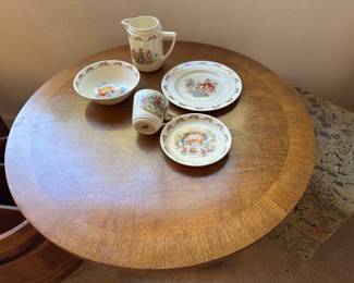 Lovely wood top of round table, and sweet Beatrix Potter Peter Rabbit child’s dishes set, timeless classic for every generation measures 26 diameter
