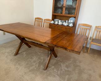 Fully extended table with four leaves inserted easily fits eight chairs, 36 x 90”