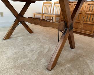Detail of metal work on table base, two chairs fit nicely between legs and one on each end, even without any leaves inserted