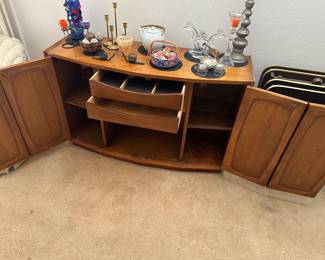 Lower shelves hold tall bottles, two inner drawers for bar accessories