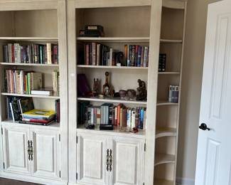 C54 - $250. 2 Piece Lighted Bookcase / Display Cabinet. Each Half measures 49" wide x 16" deep x 89.5" tall (assembled it is 98" long) has adjustable shelves with glass inserts. 