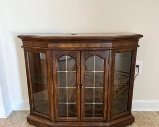 C31 - $50. Lighted Small Display Cabinet with glass shelf. Measures 36" wide x 12" deep x 30" tall. 