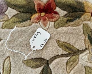 C32 - $65. Floral Rug (feels like Wool - no tag) Measures 42" x 66". 