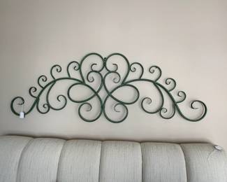 C14 - $12. Green Metal Decorative Wall Art. Measures 58" wide x 21" tall. 