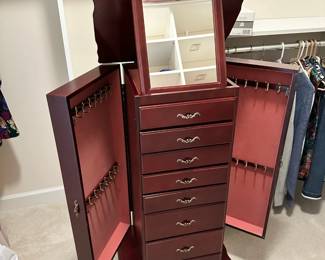 C20 - $60. Stand up Jewelry Box. Measures 18" wide x 15" deep x 40.5" tall. Missing Bottom Drawer Pull. 