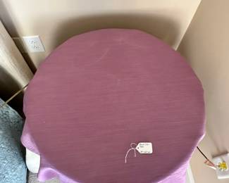 C12 - $30. Round Side Table with Purple Linens. Measures 24" round x 26" tall. 