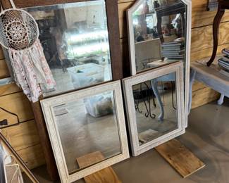 Many vintage mirrors and frames
