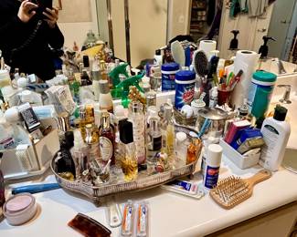 plenty of vanity table products--old perfume bottles