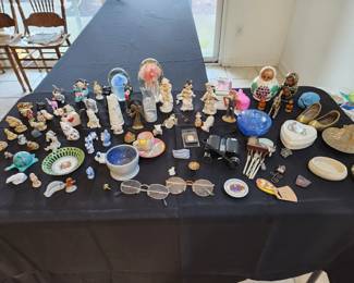 Various small figurines, Russian nesting dolls, brass trinkets