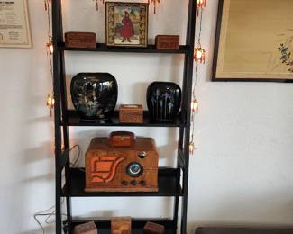 Vintage lantern string lights, various wooden boxes, Vintage airline radio and ladder style shelves