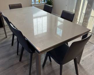 Room and Board stainless steel dining table with six chairs