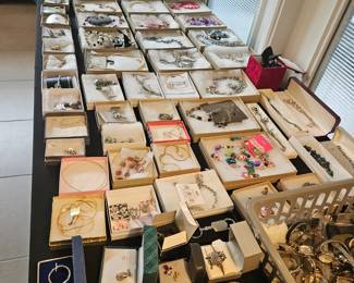 More than two large tables filled with jewelry