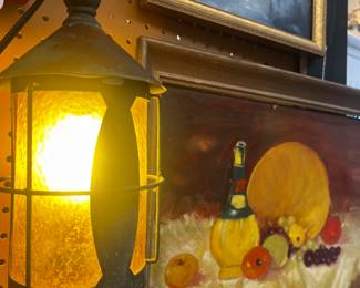 Amber glass indoor lantern and many oil paintings