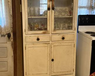 Kitchen cabinet, glasses, dishes, mugs