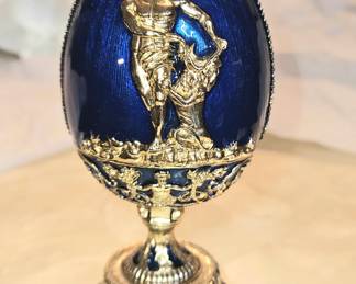 Metal and enamel egg opens.