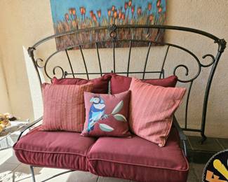 Iron piece behind settee is a king size headboard