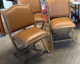 Three of the four lux folding chairs
