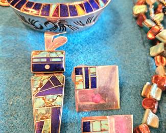 Fabulous silver inlaid pieces. Bracelet by Lonn Parker, pendant Larry Chavez, earrings Jerry N. Platore. The silver earrings are reflecting nearby color