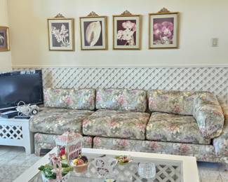 One of two floral matching sofas