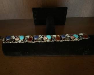 Stunning sterling linked bracelet with colored stones.