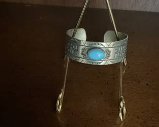 Fred Harvey era cuff with whirling logs, thunderbirds, arrows and Sleeping Beauty turquoise
