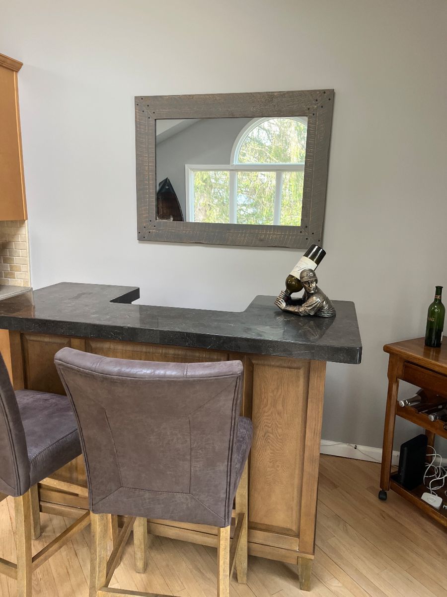 Great bar with marble top , 2 comfy bar seats , mirror , wine holder, wine glasses 