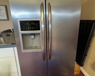 Frigidaire refrigerator located in garage. 