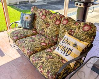 Metal glider bench with cushions. 