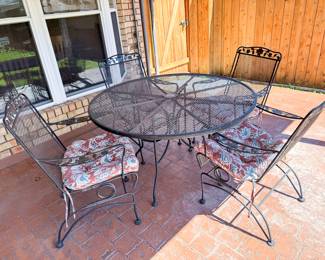 Metal table and chair patio set. 