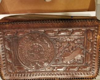 Hand tooled zippered bag with Aztec design
