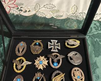 ww2 Germany medals / badges several lots like this in this auction.  some are silver and some are signed by manufacturers
