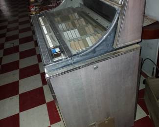 Old Seeburg jukebox for parts or repair. , still full of 45 rpm records.  Money box is locked w no key and appears to still have money inside. 