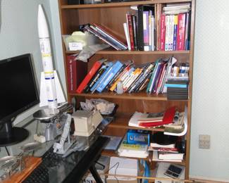 Books and another bookcase too, and Detroit Pistons, glass pendant lamp