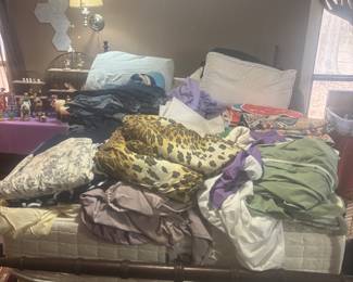 Lots of blankets, sheets, pet blankets, comforters, blue jeans, Nine Line tshirts, and queen size bed w headboard/footboard