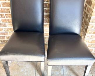 Black faux leather chairs - 8 available