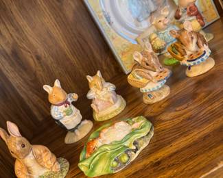 collection of Beatrix Potter figurines and memorabilia