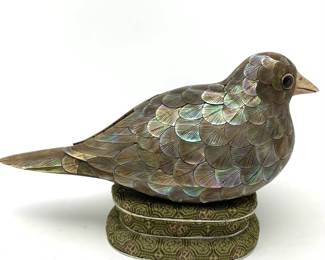 LOT 55 Register: www.woodardlipe.com RARE MOTHER OF PEARL INLAY WOODEN SPARROW BOX, QIANLONG PERIOD, CHINA, 18TH CENTURY Length 4.5 in., width 2.5 in., height 2.75 in, An extraordinarily rare and beautiful diminutive Chinese Mandarin sparrow-form covered boxes, finely modeled with their heads raised and their bodies overlaid with meticulously carved and detailed mother-of-pearl feathers, both with great charm and personality. A small piece of each back lifts to form the cover of each box and reveals a mother-of-pearl Qianlong mark, again, painstakingly carved out of mother-of-pearl, and each duck nestled, perfectly fitting, into their own custom stand. Condition: Excellent.