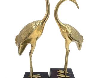 LOT 20 Register: www.woodardlipe.com PAIR OF BRASS EGRETS With stand: Length 5.25 in, width 5 in, height 19.5 in. Pair of vintage brass cranes or egrets standing tall on block of black lucite base with wear consistent with age.